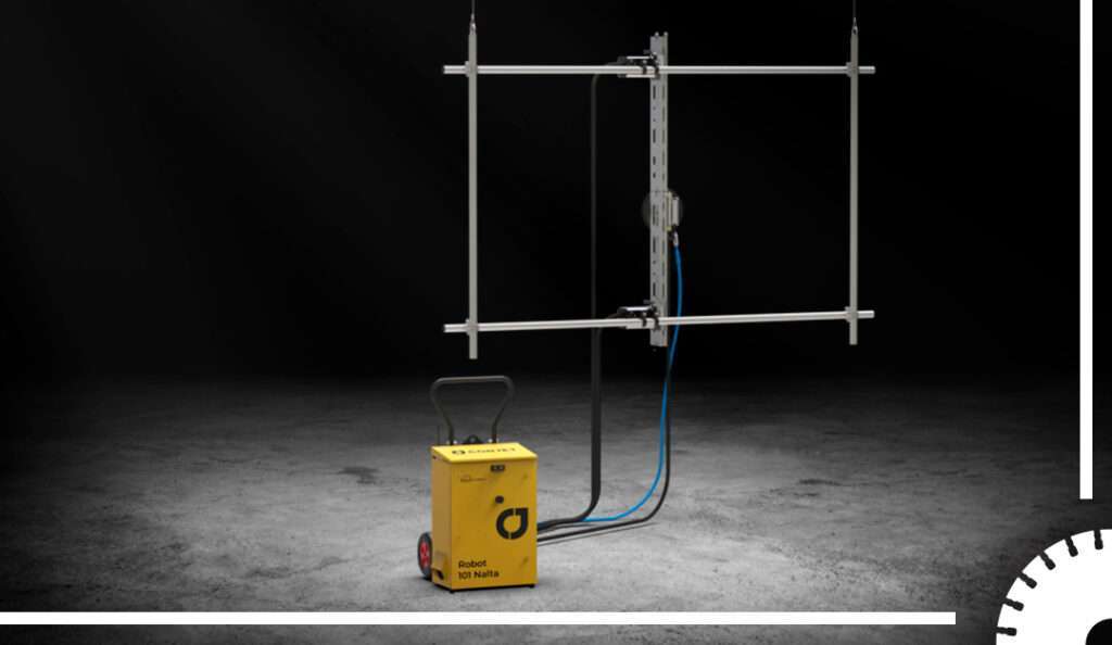 Hydrodemolition concrete cutting robot mounted on a vertical frame, ready to remove concrete with high‑pressure water jets on a dark background