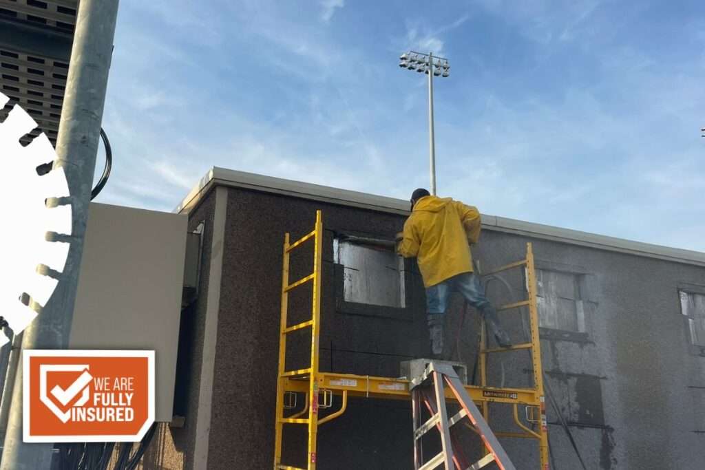 hand sawing reinforced concrete for HVAC installation
