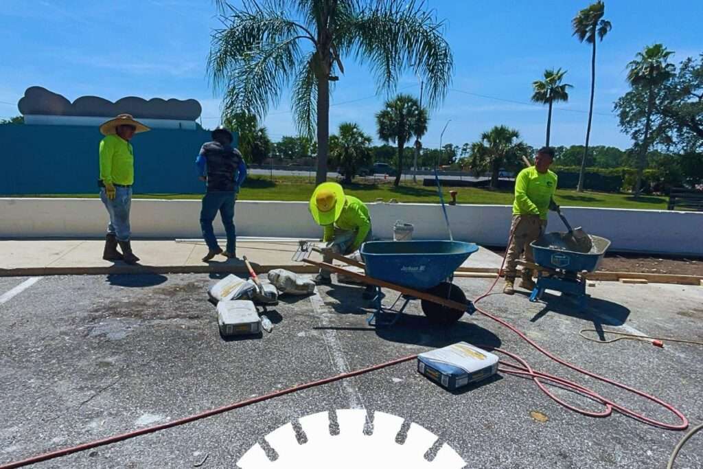 professional concrete cutting crew working on commercial construction site
