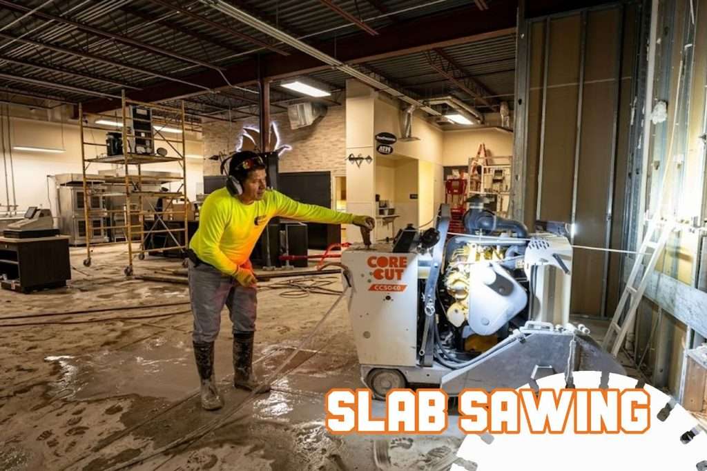 Worker performing slab sawing with a diamond blade on a commercial concrete slab in Florida